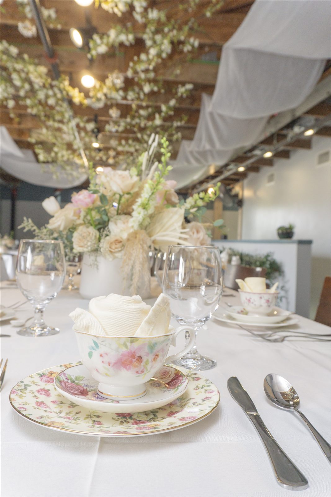 Long hosted tea table with floral china